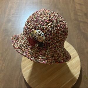 Crochet ribbon hat with pin